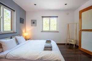 Voodi või voodid majutusasutuse Forest Hideaway toas