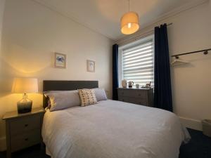 Ліжко або ліжка в номері Rooms At Babbacombe