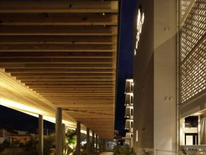 a night view of a building with a ceiling at Hotel Locus in Miyako Island
