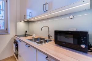 Kuchyň nebo kuchyňský kout v ubytování House Catania