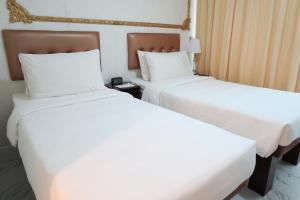 En eller flere senger på et rom på Best Western Plus Tsim Sha Tsui