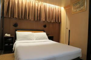 En eller flere senger på et rom på Best Western Plus Tsim Sha Tsui