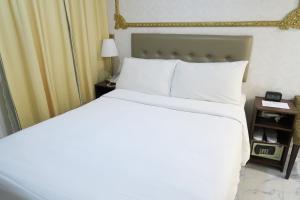 En eller flere senger på et rom på Best Western Plus Tsim Sha Tsui