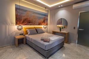 Un pat sau paturi într-o cameră la Maltinas Apartments