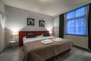 Ένα ή περισσότερα κρεβάτια σε δωμάτιο στο Hotel Joli Bergen +27 φωτογραφίες