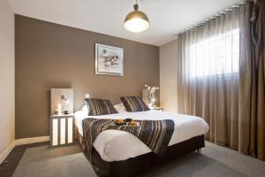 Postel nebo postele na pokoji v ubytování Appart'City Confort Marseille Centre Prado Vélodrome