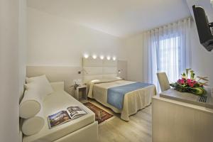 Postel nebo postele na pokoji v ubytování Hotel Hollywood***S