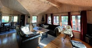 a living room with a couch and a table at Sundebu, Spacious 5-Bedroom mountain cabin near Ski and Hiking in Rauland