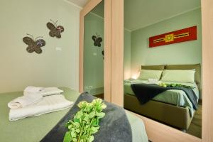 A bed or beds in a room at Il SOLE HOUSE