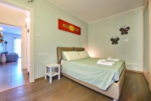 A bed or beds in a room at Il SOLE HOUSE