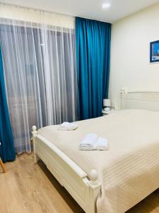 Postel nebo postele na pokoji v ubytování New Gudauri Twins 121