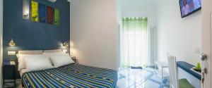 Postel nebo postele na pokoji v ubytování B&B Amalfè