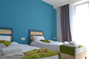 Voodi või voodid majutusasutuse Kaghni Hotel toas