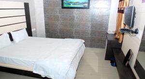 Postel nebo postele na pokoji v ubytování The Sky Comfort - Hotel The Heaven, Dwarka