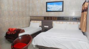 Postel nebo postele na pokoji v ubytování The Sky Comfort - Hotel The Heaven, Dwarka
