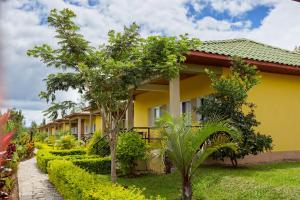a row of houses with trees in front of them at Andasibe Lemurs Lodge in Andasibe
