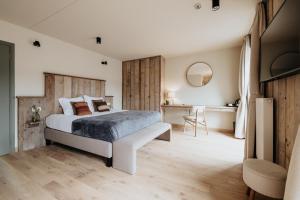 Postel nebo postele na pokoji v ubytování La Merveilleuse by Infiniti hôtel