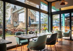a restaurant with a view of the tower of london at The Tower Hotel, London in London