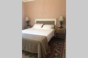 Postel nebo postele na pokoji v ubytování Villa Luis + 17 fotografií