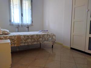 Posteľ alebo postele v izbe v ubytovaní Residenza Silvestro a 2 minuti dalla fiera e dal mare!