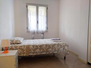 Posteľ alebo postele v izbe v ubytovaní Residenza Silvestro a 2 minuti dalla fiera e dal mare!