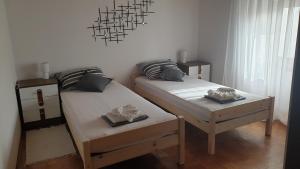 Postel nebo postele na pokoji v ubytování Apartman Lusi