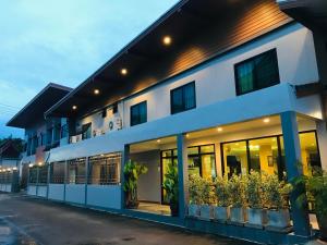 a building with plants on the side of it at ช้างเผือกเกสต์เฮ้าส์ Changphueak Guesthouse in Nan