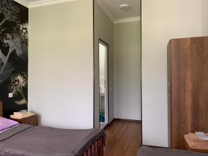 A bed or beds in a room at Guest House Demma