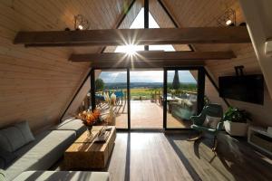 a living room with a couch and a table at Woodparadise in Nagyrada