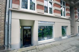 a facade of a building with windows and a storefront at Basement Rotherbaum in Hamburg