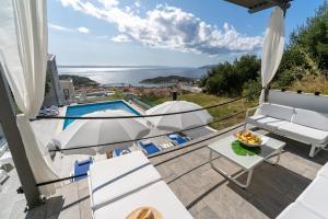 a villa with a view of the pool and the ocean at NEW! Villa Lea 5-bedroom villa with private pool and amazing views of city and sea in Makarska