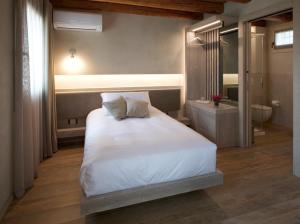 Ένα ή περισσότερα κρεβάτια σε δωμάτιο στο Locanda MaMaGiò