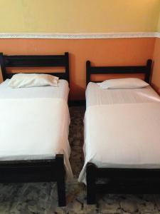 Cama o camas de una habitación en Hotel El Diamante CA