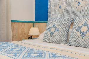 Postel nebo postele na pokoji v ubytování Il Borgo BagaBaga - Exclusive Country Retreat