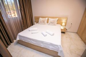 Postel nebo postele na pokoji v ubytování Riva Apartment