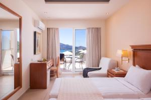 Posteľ alebo postele v izbe v ubytovaní Avalon Palace Hotel