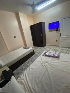A bed or beds in a room at ALRahman Building