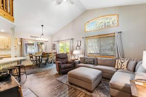 a living room with a couch and a table at McCall Cottage Cabin in McCall