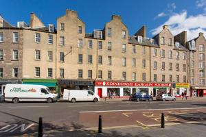 a large building with cars parked in front of it at Modern & bright 1 bed for 4 close to city centre! in Edinburgh