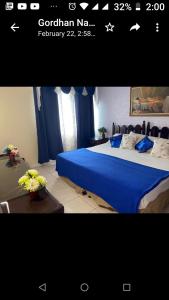 Ένα ή περισσότερα κρεβάτια σε δωμάτιο στο Beach-side condos at Turtle Beach Towers