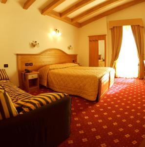 Posteľ alebo postele v izbe v ubytovaní Hotel Il Maniero
