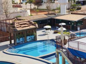 an overhead view of a pool at a hotel at Apartamento Millenium Otima Localizacao E Nova Area DE Lazer!!! in Caldas Novas