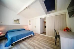 Voodi või voodid majutusasutuse Hotel Capo Di Stella toas