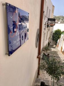 a sign on the side of a building on a street at "Sweet Life" Casa Vacanze in Lipari