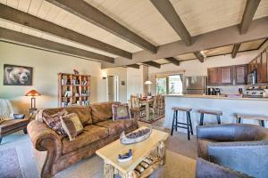 a living room with a couch and a table at Patio and Fireplace Country Club Pinetop Condo! in Indian Pine