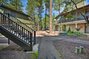 a stairway leading to a building with a house at Patio and Fireplace Country Club Pinetop Condo! in Indian Pine