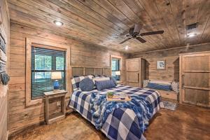 a bedroom with a bed and a ceiling fan at Luxe Cabin with Tesla Charging Station, 3 Mi to Lake in Stephens Gap