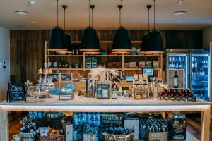 a store filled with lots of bottles of wine at Los Jardines de Abama Suites in Guía de Isora