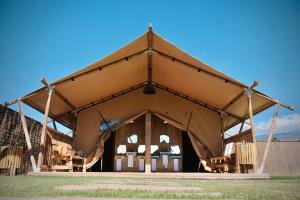 a large tent with chairs in front of it at Los Jardines de Abama Suites in Guía de Isora