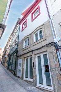 a building on a street in a city at Host'olaria in Lamego